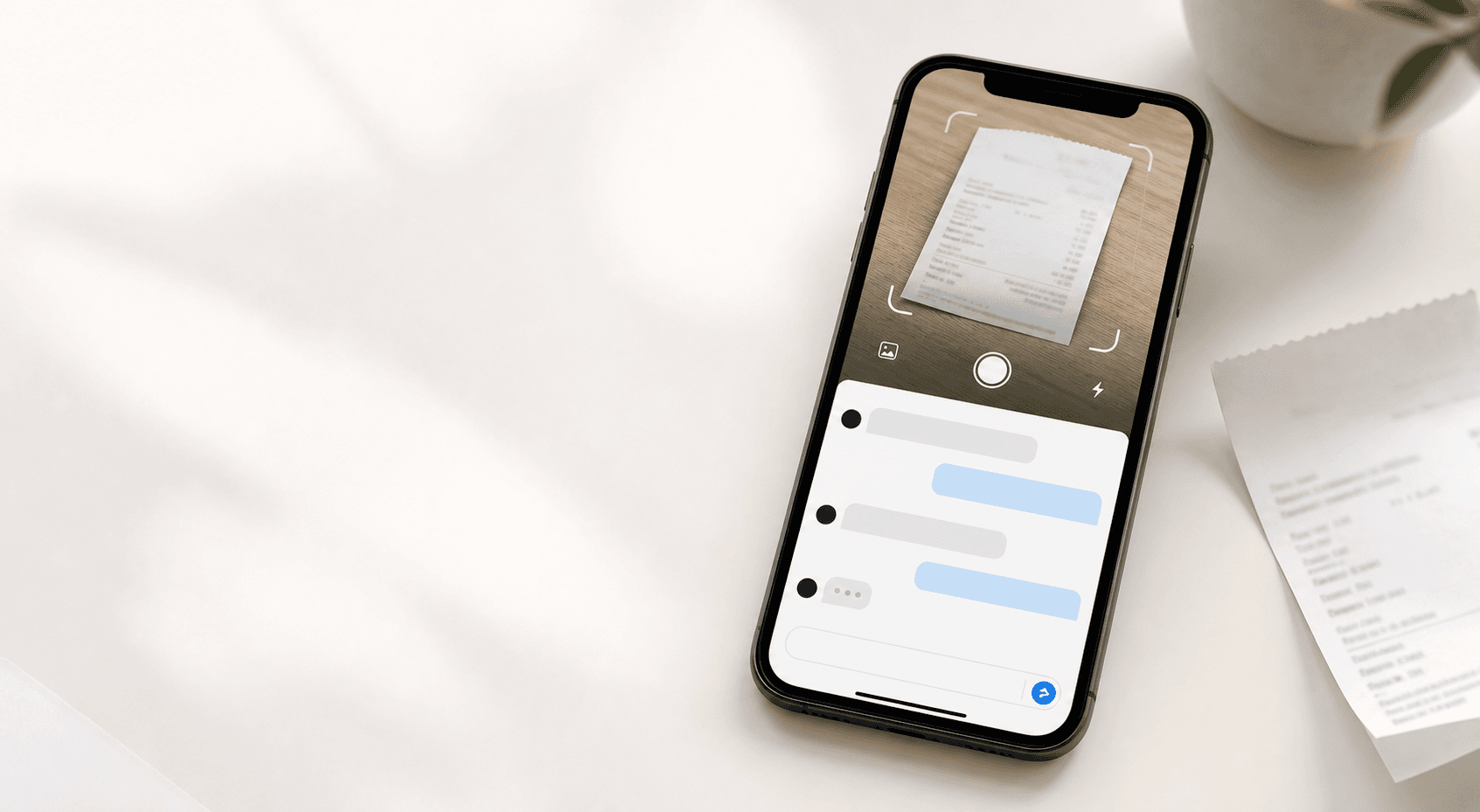 A phone showing receipt capture and chat